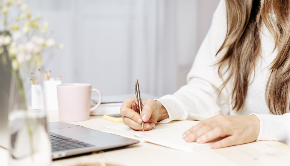 Woman writing in journal