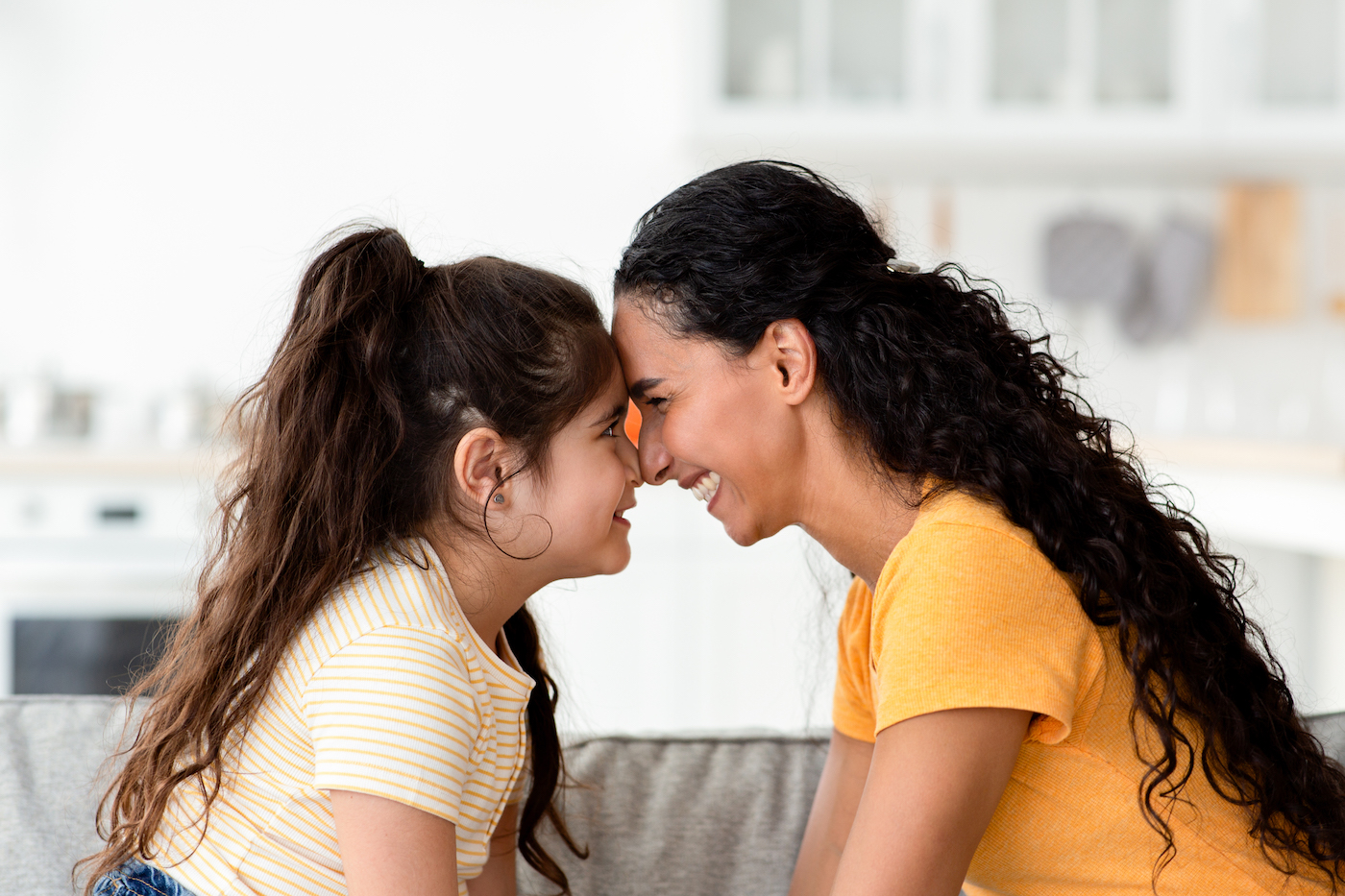 A Type 1 Diabetes Caregiver Smiling At Her Young Daughter