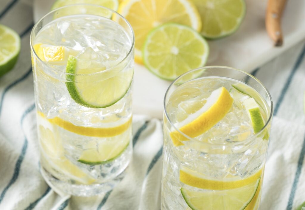 iced water with lime and lemon in a clear glass