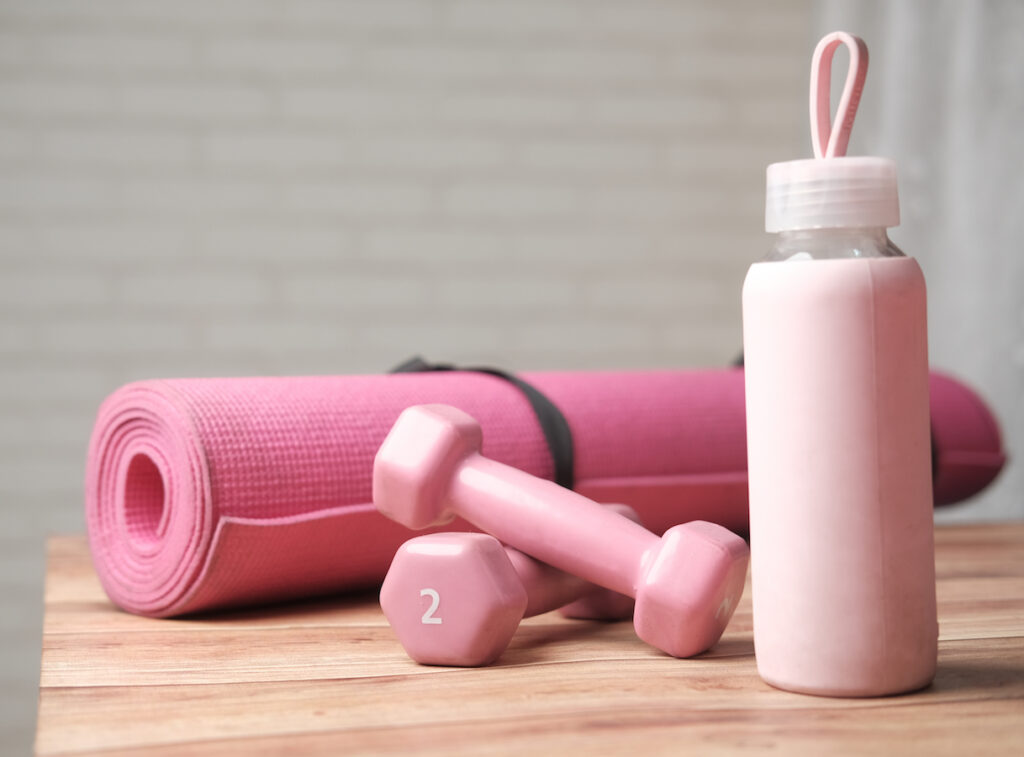 Pink water bottle and pink yoga mat