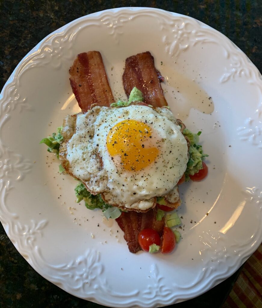 Egg and bacon breakfast on white plate - Type Won Coaching™